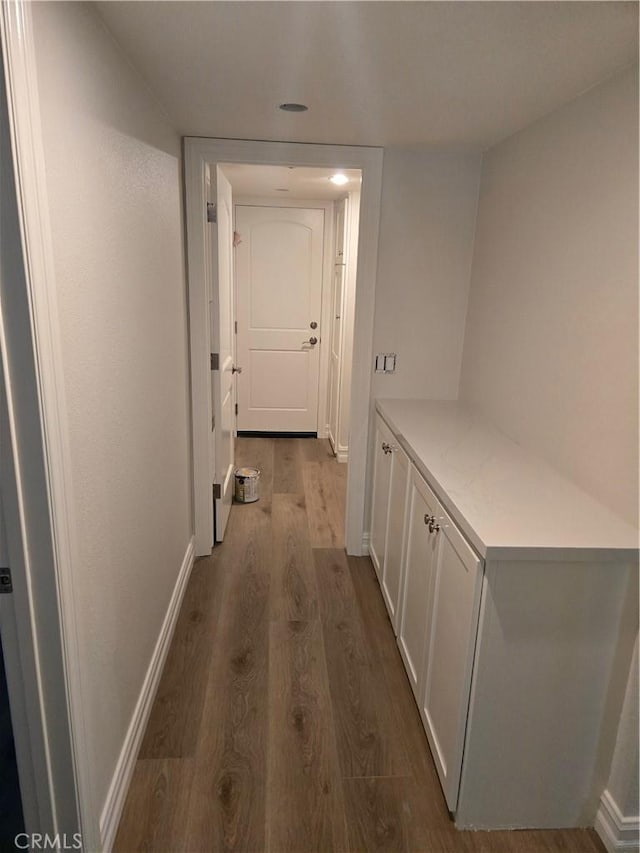 10281 Kings St, Los Alamitos, CA 90720 - corridor with dark wood-type flooring and baseboards