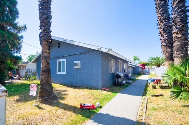 188 E 11th St Unit 1-4, San Bernardino, CA 92410 - view of side of property with stucco siding
