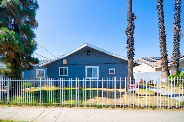 188 E 11th St Unit 1-4, San Bernardino, CA 92410 - bungalow-style house featuring stucco siding and a fenced front yard