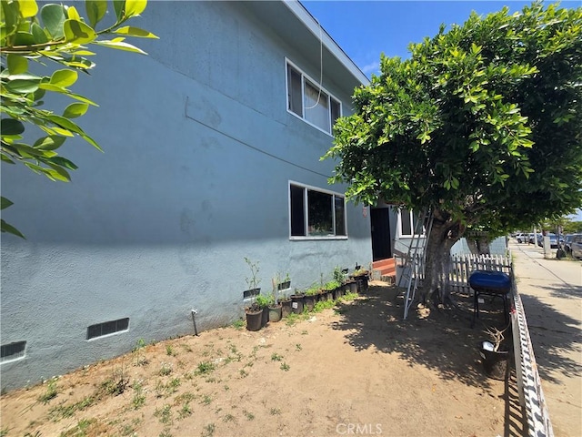923 W G St Unit 8, Wilmington, CA 90744 - view of property exterior featuring entry steps and stucco siding