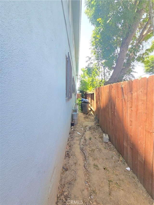 923 W G St Unit 8, Wilmington, CA 90744 - view of side of home with stucco siding