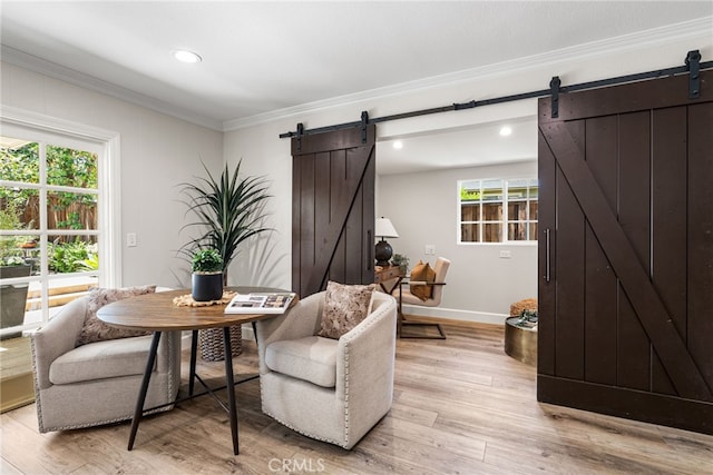 11212 Brunswick Way N, Tustin, CA 92705 - dining area with a barn door, crown molding, light wood-style floors, and recessed lighting