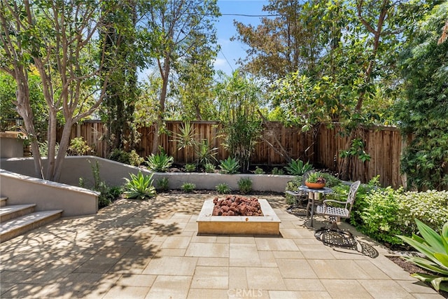 11212 Brunswick Way N, Tustin, CA 92705 - fenced backyard with an outdoor fire pit and a patio