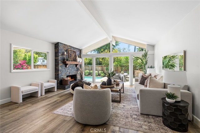 11212 Brunswick Way N, Tustin, CA 92705 - living area featuring a fireplace, healthy amount of natural light, and wood finished floors