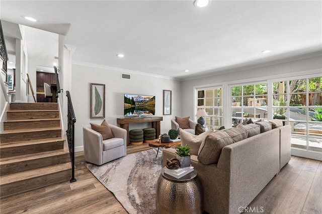 11212 Brunswick Way N, Tustin, CA 92705 - living area featuring wood finished floors, crown molding, stairway, and recessed lighting