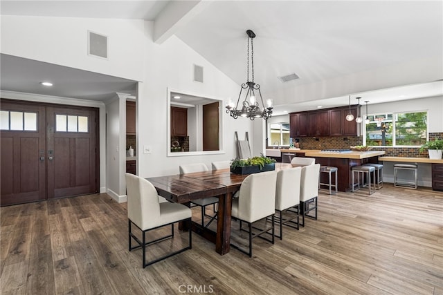 11212 Brunswick Way N, Tustin, CA 92705 - dining area featuring wood finished floors, beamed ceiling, a chandelier, recessed lighting, and high vaulted ceiling