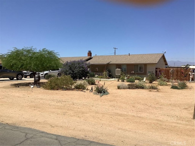 10578 Jamul Rd, Apple Valley, CA 92308 - view of front of house featuring a chimney and stucco siding