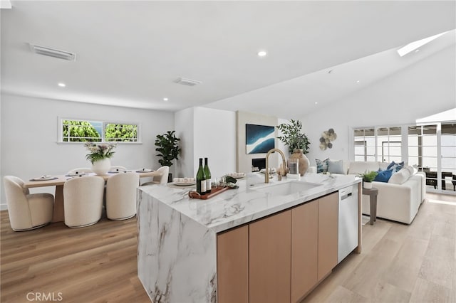 2134 N Towner St, Santa Ana, CA 92706 - kitchen featuring open floor plan, light wood finished floors, a kitchen island with sink, light stone countertops, and recessed lighting