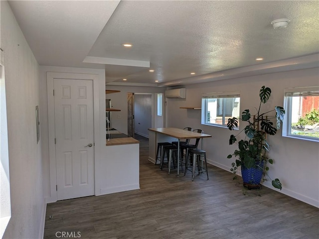 4020 F St, Eureka, CA 95503 - kitchen with wood finished floors, healthy amount of natural light, a wall unit AC, and recessed lighting