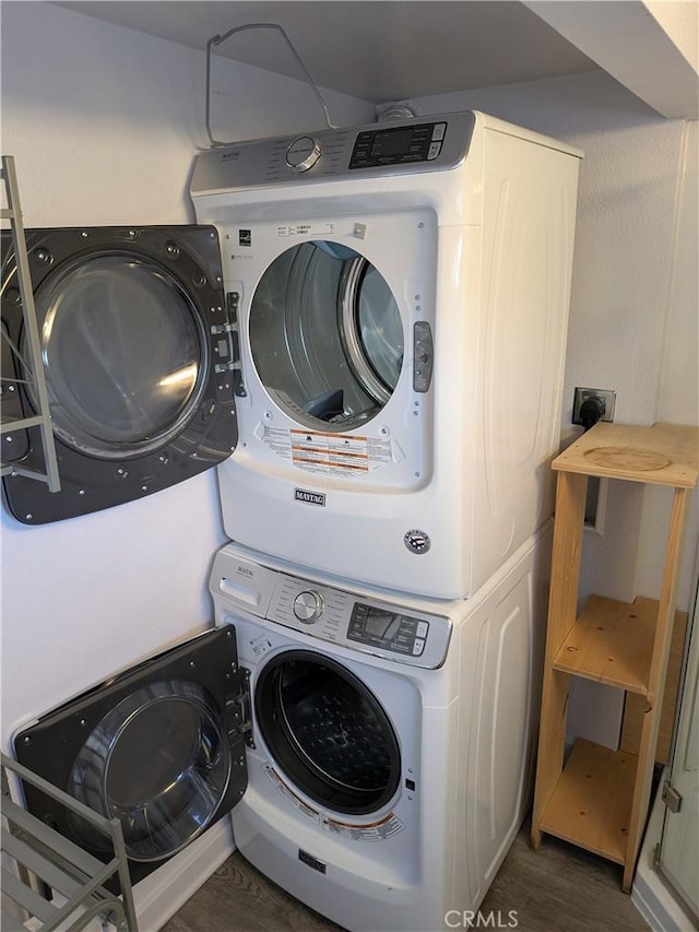 4020 F St, Eureka, CA 95503 - laundry room with stacked washer / dryer and dark wood-style floors