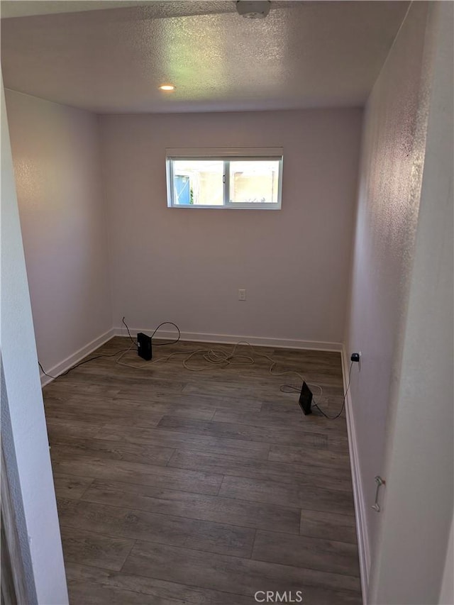 4020 F St, Eureka, CA 95503 - unfurnished room with dark wood-style flooring and a textured ceiling