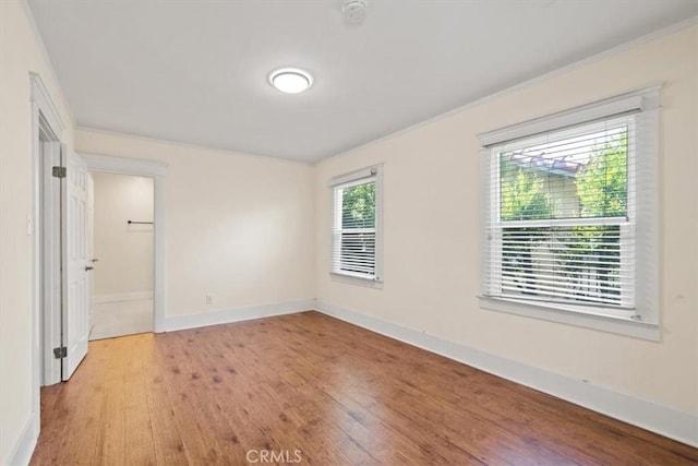 268 S Norton Ave, Los Angeles, CA 90004 - unfurnished bedroom featuring wood finished floors and baseboards