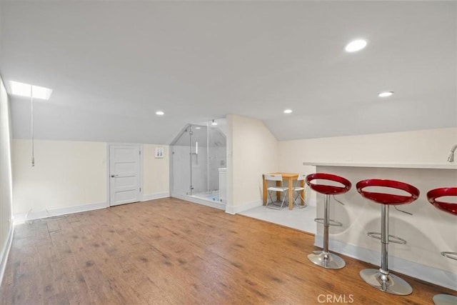 268 S Norton Ave, Los Angeles, CA 90004 - additional living space with vaulted ceiling, wood finished floors, and recessed lighting