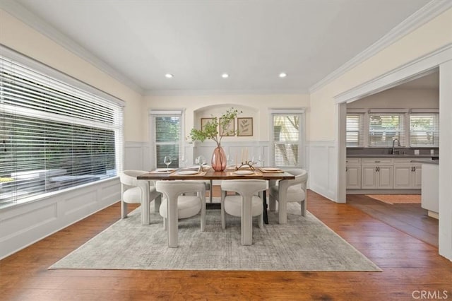 268 S Norton Ave, Los Angeles, CA 90004 - dining area featuring crown molding, wainscoting, wood finished floors, and a decorative wall