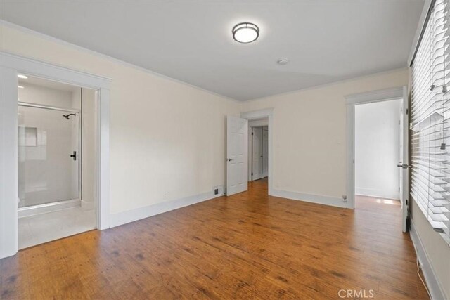 268 S Norton Ave, Los Angeles, CA 90004 - spare room with wood finished floors and crown molding