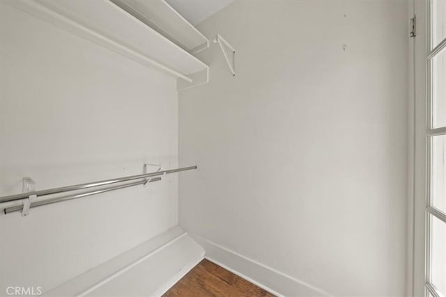268 S Norton Ave, Los Angeles, CA 90004 - walk in closet featuring dark wood-type flooring