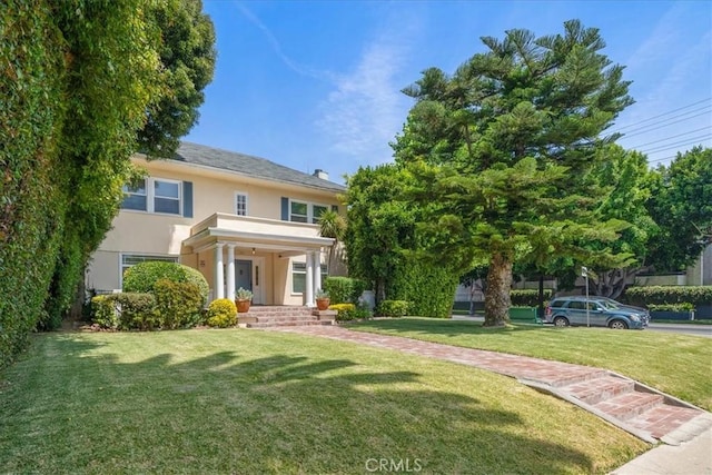 268 S Norton Ave, Los Angeles, CA 90004 - view of front facade featuring stucco siding and a front yard