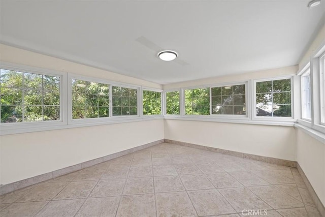 268 S Norton Ave, Los Angeles, CA 90004 - unfurnished sunroom with baseboards and tile patterned floors