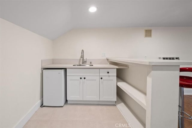 268 S Norton Ave, Los Angeles, CA 90004 - bar featuring vaulted ceiling, recessed lighting, and fridge
