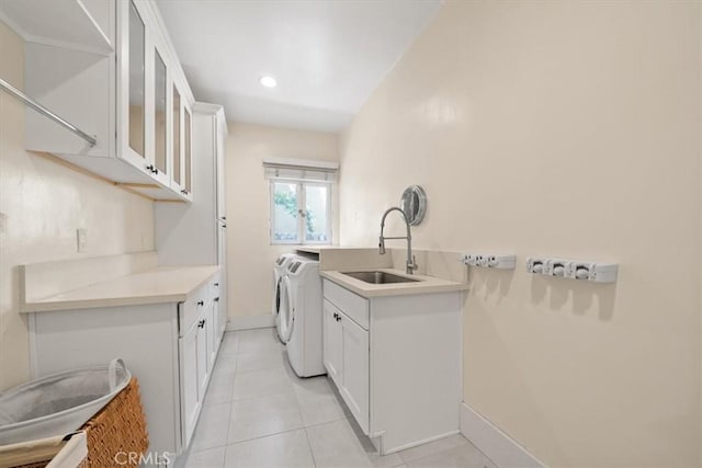 268 S Norton Ave, Los Angeles, CA 90004 - laundry room featuring washing machine and dryer, cabinet space, light tile patterned floors, and recessed lighting