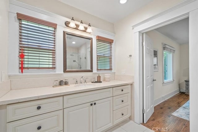 268 S Norton Ave, Los Angeles, CA 90004 - bathroom featuring a stall shower, vanity, and wood finished floors
