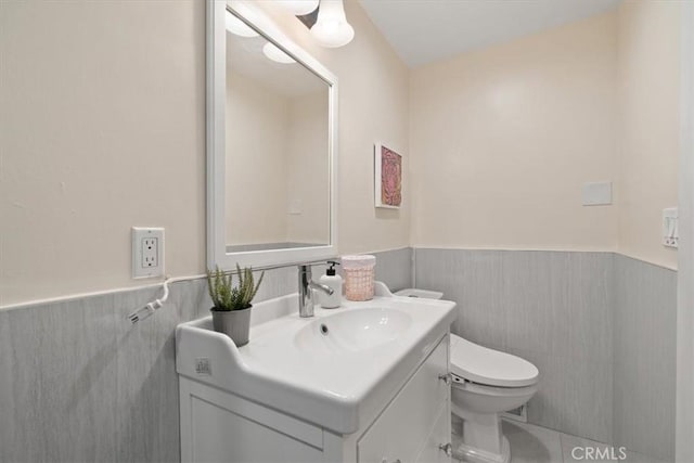 268 S Norton Ave, Los Angeles, CA 90004 - bathroom with wainscoting, vanity, and tile walls