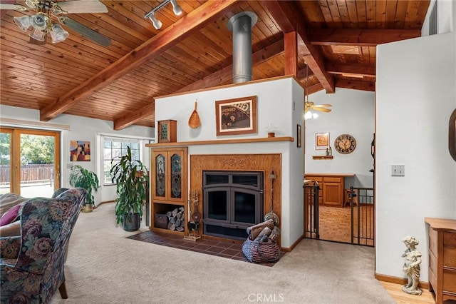 512 S Crawford Ave, Willows, CA 95988 - carpeted living area with a ceiling fan, wood ceiling, rail lighting, and a fireplace with flush hearth