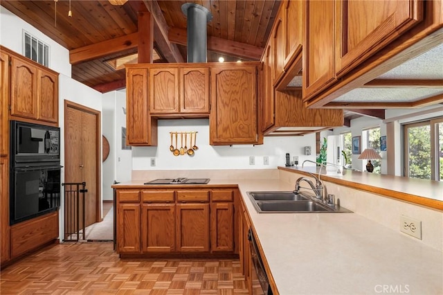 512 S Crawford Ave, Willows, CA 95988 - kitchen with black appliances, light countertops, wooden ceiling, brown cabinetry, and a peninsula