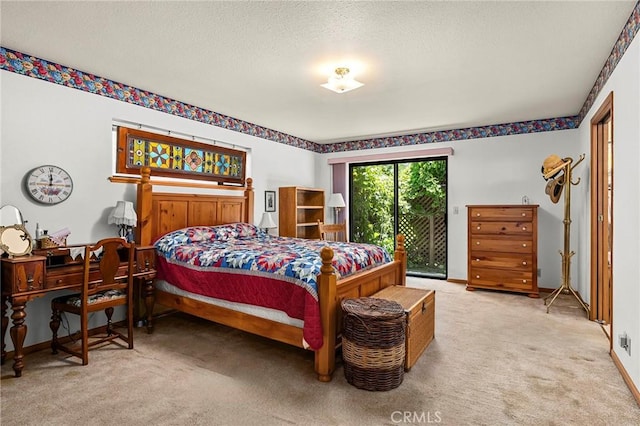 512 S Crawford Ave, Willows, CA 95988 - carpeted bedroom featuring access to outside and a textured ceiling