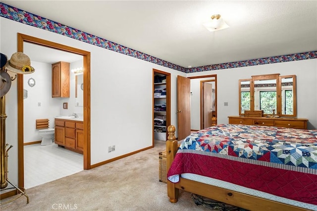 512 S Crawford Ave, Willows, CA 95988 - bedroom with light colored carpet, a walk in closet, ensuite bath, and a closet