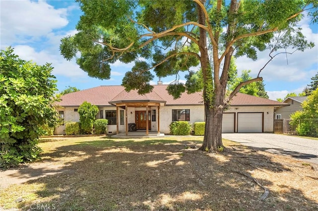 512 S Crawford Ave, Willows, CA 95988 - single story home with driveway, an attached garage, and stucco siding