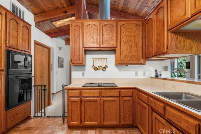 512 S Crawford Ave, Willows, CA 95988 - kitchen with wooden ceiling, black appliances, light countertops, and brown cabinetry