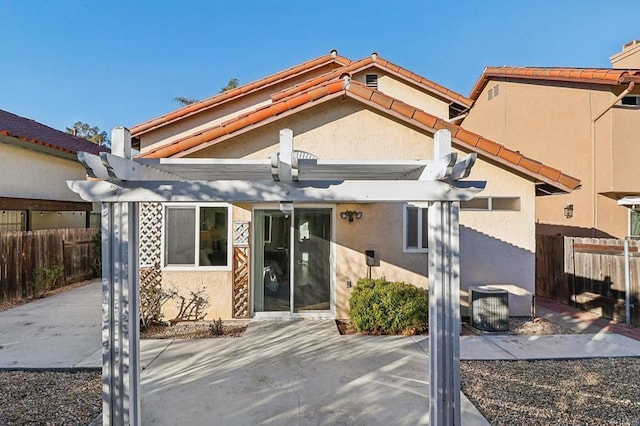 1837 Avenida Sevilla, Oceanside, CA 92056 - rear view of house featuring a pergola, stucco siding, a patio area, and a tiled roof