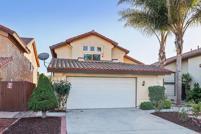 1837 Avenida Sevilla, Oceanside, CA 92056 - mediterranean / spanish home with stucco siding, driveway, a tiled roof, and a garage