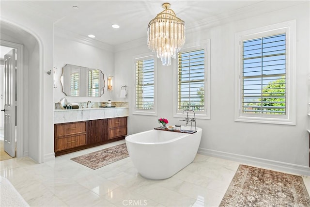 7 Kent Ct, Ladera Ranch, CA 92694 - bathroom with vanity, a soaking tub, crown molding, a chandelier, and marble finish floors