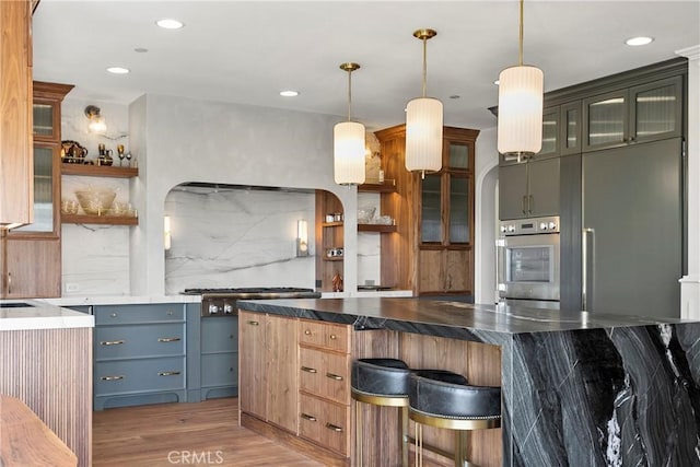 7 Kent Ct, Ladera Ranch, CA 92694 - kitchen featuring light wood finished floors, open shelves, appliances with stainless steel finishes, pendant lighting, and recessed lighting