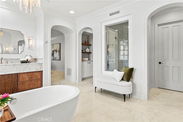 7 Kent Ct, Ladera Ranch, CA 92694 - bathroom featuring a freestanding bath, vanity, ornamental molding, built in shelves, and a stall shower