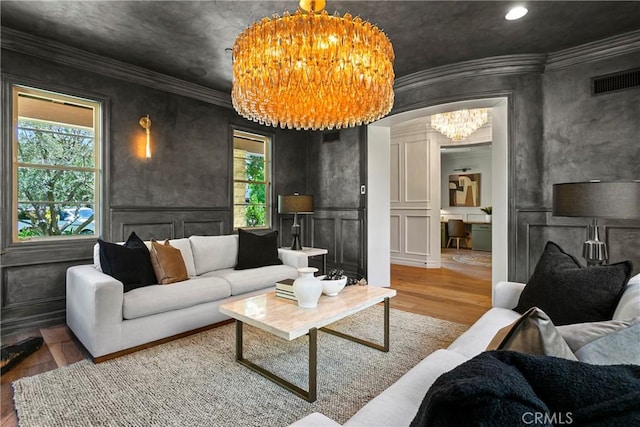 7 Kent Ct, Ladera Ranch, CA 92694 - living room featuring wood finished floors, a decorative wall, a chandelier, crown molding, and recessed lighting