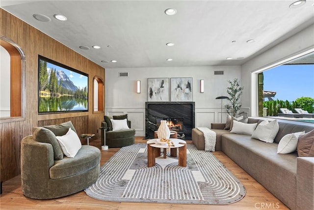 7 Kent Ct, Ladera Ranch, CA 92694 - living area featuring wood finished floors, recessed lighting, a premium fireplace, and arched walkways