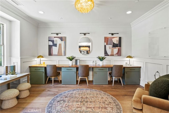 7 Kent Ct, Ladera Ranch, CA 92694 - living room featuring built in desk, wood finished floors, crown molding, recessed lighting, and a wainscoted wall