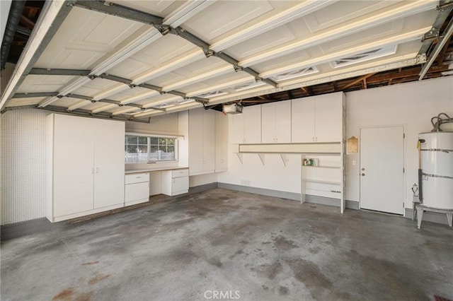 12751 9th St, Garden Grove, CA 92840 - garage with water heater and a garage door opener