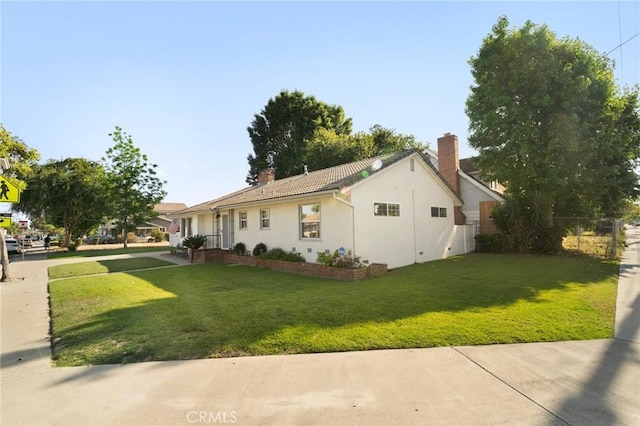 12751 9th St, Garden Grove, CA 92840 - view of property exterior featuring stucco siding and a chimney