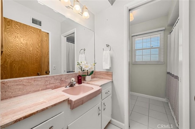 12751 9th St, Garden Grove, CA 92840 - bathroom featuring vanity, tile patterned floors, and tasteful backsplash