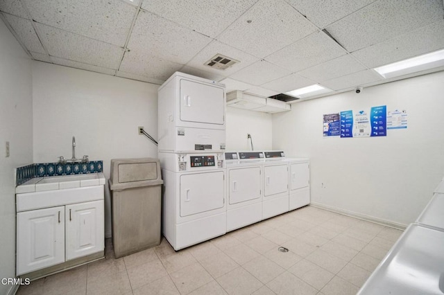 7211 Cozycroft Ave Unit 40, Winnetka, CA 91306 - laundry area featuring cabinet space and stacked washer and clothes dryer