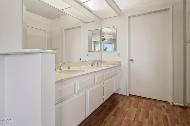 7211 Cozycroft Ave Unit 40, Winnetka, CA 91306 - bathroom with double vanity and wood finished floors