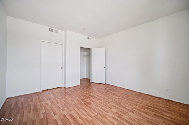 7211 Cozycroft Ave Unit 40, Winnetka, CA 91306 - unfurnished bedroom with light wood-type flooring and a closet