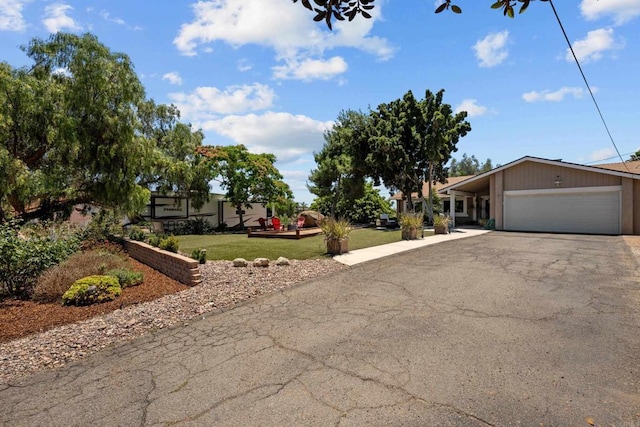 764 Barsby St, Vista, CA 92084 - view of front facade featuring asphalt driveway, a garage, and a front lawn