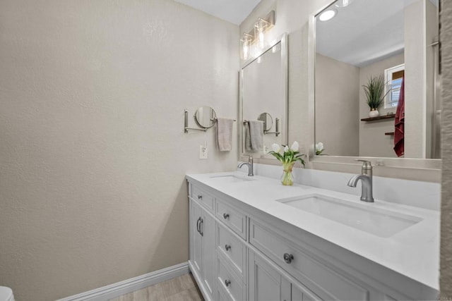 764 Barsby St, Vista, CA 92084 - bathroom featuring double vanity and a textured wall