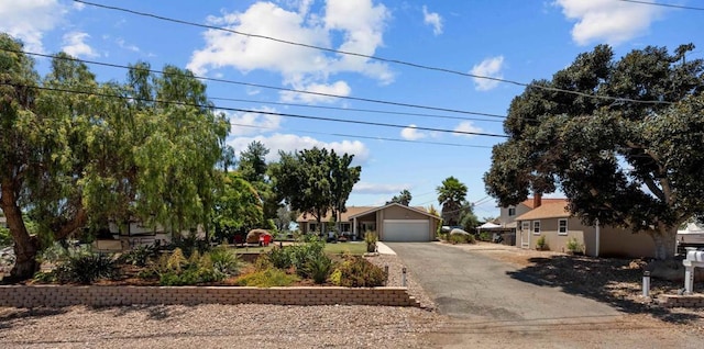 764 Barsby St, Vista, CA 92084 - obstructed view of property featuring asphalt driveway and an attached garage