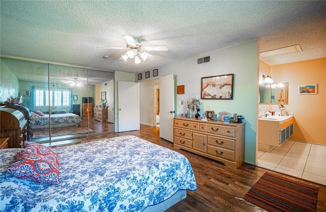 9739 Reseda Blvd Unit 36, Northridge, CA 91324 - bedroom featuring a textured ceiling, wood finished floors, and ceiling fan